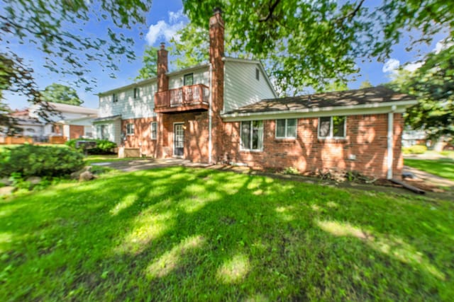 29947 Fernhill Dr, Farmington, MI 48331 - back of house featuring a balcony, a yard, brick siding, and a chimney
