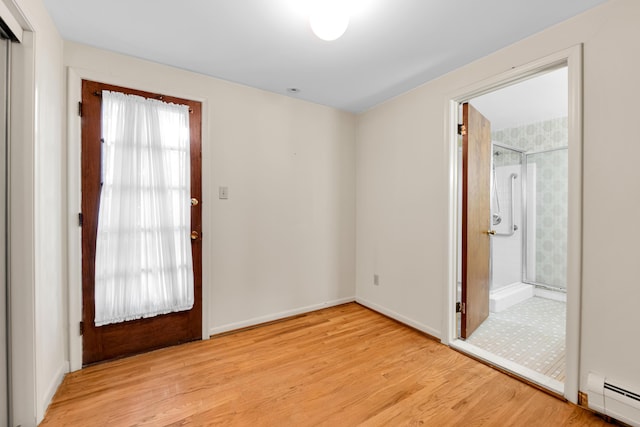 29947 Fernhill Dr, Farmington, MI 48331 - empty room with a baseboard radiator and light wood-type flooring