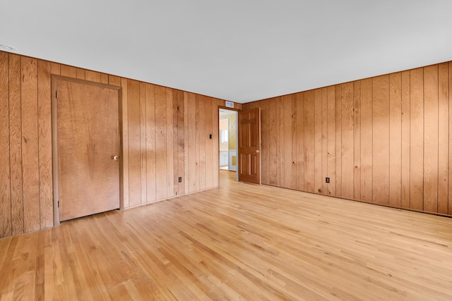 29947 Fernhill Dr, Farmington, MI 48331 - unfurnished bedroom featuring wood finished floors and wood walls