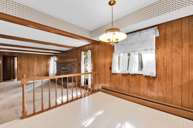 29947 Fernhill Dr, Farmington, MI 48331 - spare room featuring a baseboard radiator, wood walls, a chandelier, a fireplace, and beamed ceiling