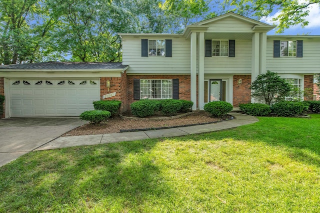 29947 Fernhill Dr, Farmington, MI 48331 - view of front of house featuring brick siding, an attached garage, driveway, and a front yard