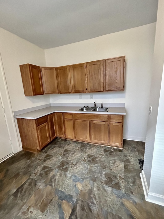 5208 Commonwealth St, Detroit, MI 48208 - kitchen with brown cabinets and light countertops