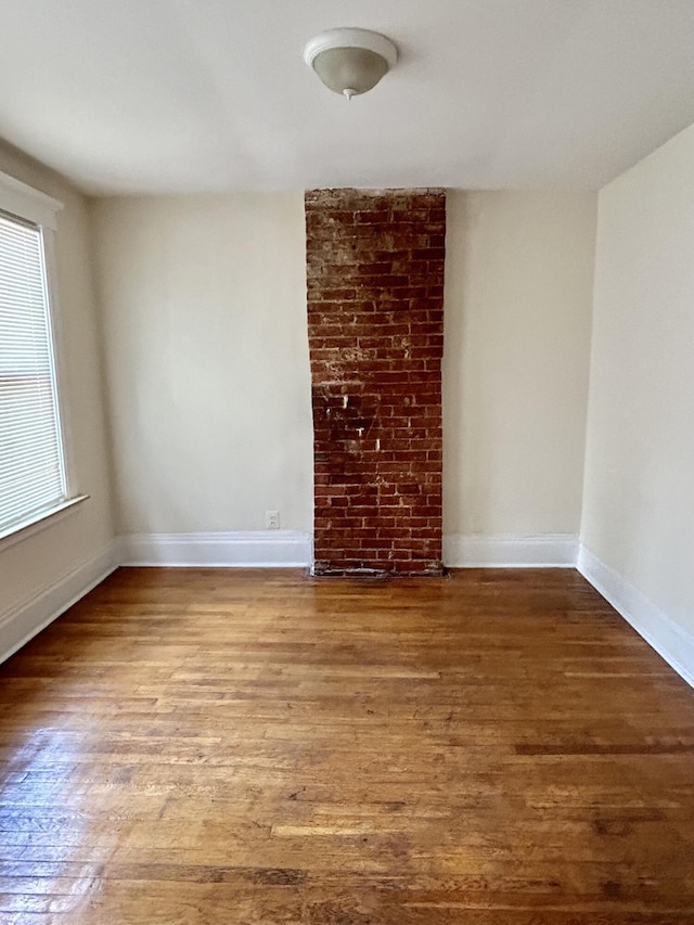 5208 Commonwealth St, Detroit, MI 48208 - spare room with wood finished floors and baseboards