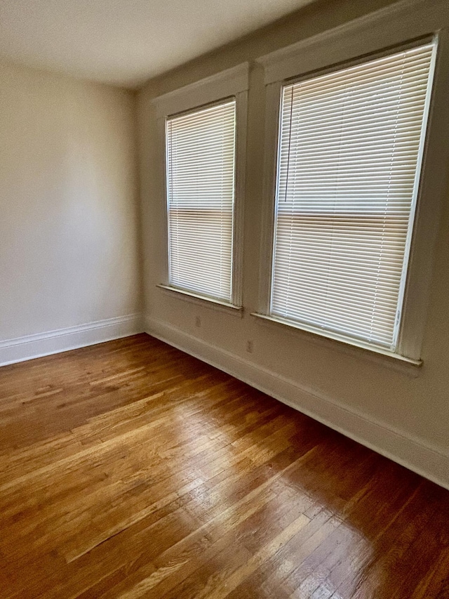 5208 Commonwealth St, Detroit, MI 48208 - empty room with baseboards and wood finished floors