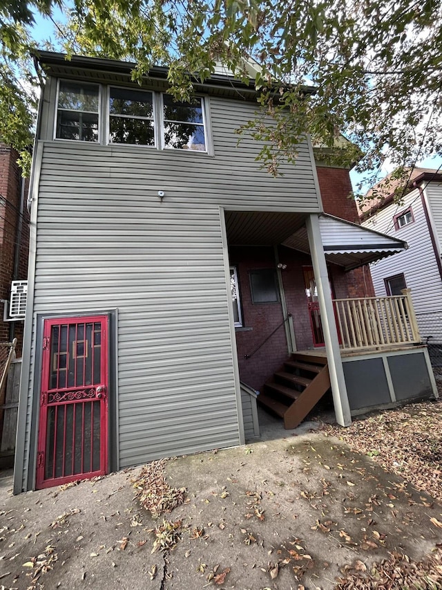 5208 Commonwealth St, Detroit, MI 48208 - rear view of house with covered porch and brick siding