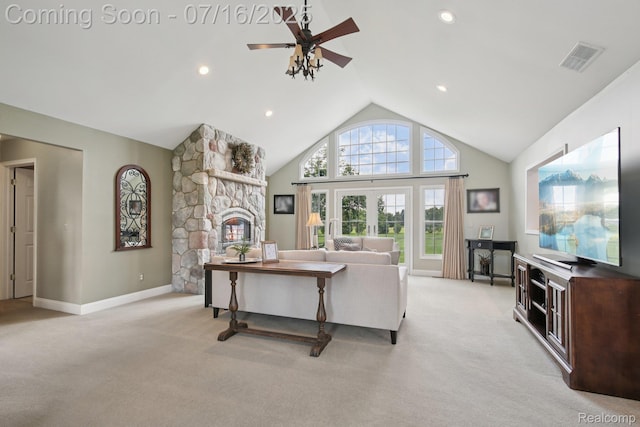 378 Fruitdale Ln, Pinckney, MI 48169 - living room with light colored carpet, a ceiling fan, vaulted ceiling, a fireplace, and recessed lighting