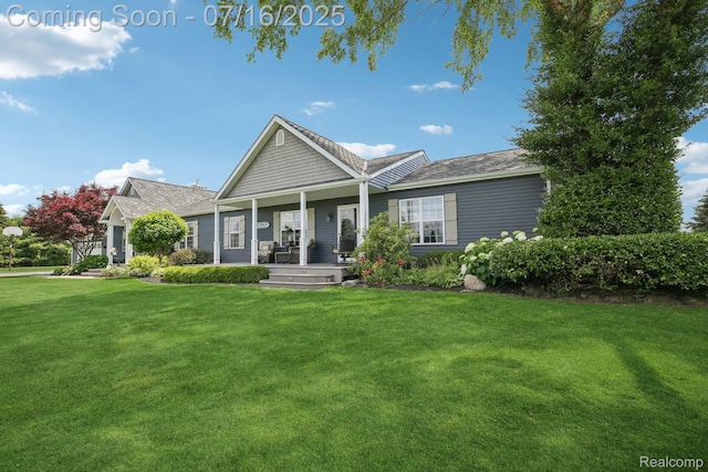 378 Fruitdale Ln, Pinckney, MI 48169 - view of front of house with covered porch and a front lawn