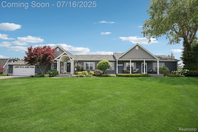 378 Fruitdale Ln, Pinckney, MI 48169 - view of front of house featuring a front yard, concrete driveway, and a porch