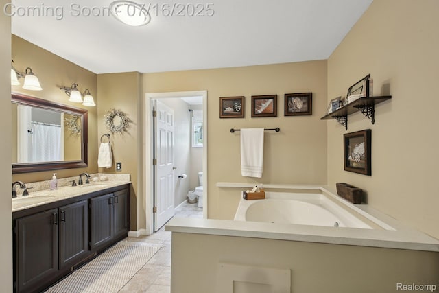 378 Fruitdale Ln, Pinckney, MI 48169 - bathroom featuring double vanity, a garden tub, and tile patterned floors