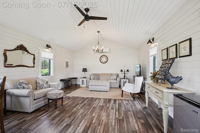 378 Fruitdale Ln, Pinckney, MI 48169 - living room with dark wood-style floors, lofted ceiling, wood walls, a ceiling fan, and a chandelier