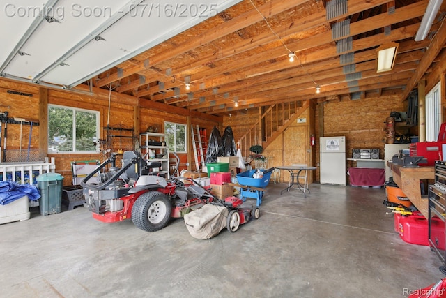 378 Fruitdale Ln, Pinckney, MI 48169 - garage with freestanding refrigerator