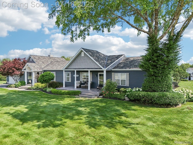 378 Fruitdale Ln, Pinckney, MI 48169 - view of front of house with a front lawn and a porch