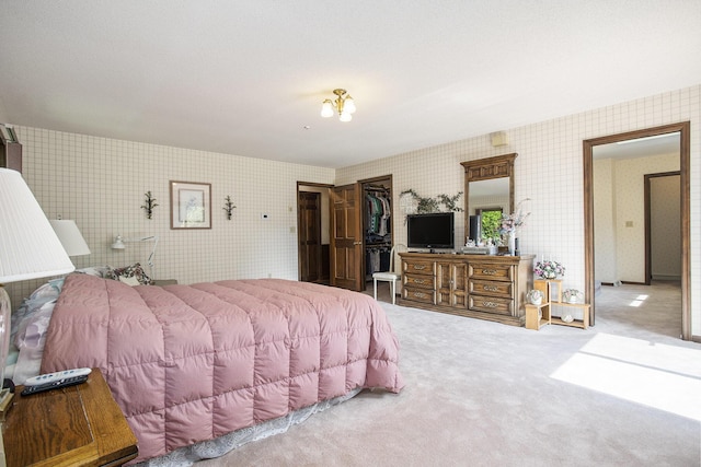 335 Fairway Dr, Coldwater, MI 49036 - bedroom featuring wallpapered walls, carpet floors, a closet, and a spacious closet