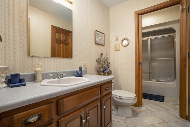 335 Fairway Dr, Coldwater, MI 49036 - full bath with vanity, combined bath / shower with glass door, tile patterned floors, and wallpapered walls