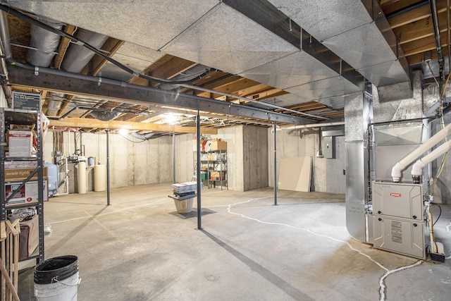335 Fairway Dr, Coldwater, MI 49036 - unfinished below grade area with heating unit, a water softener, electric panel, and a water pressure tank