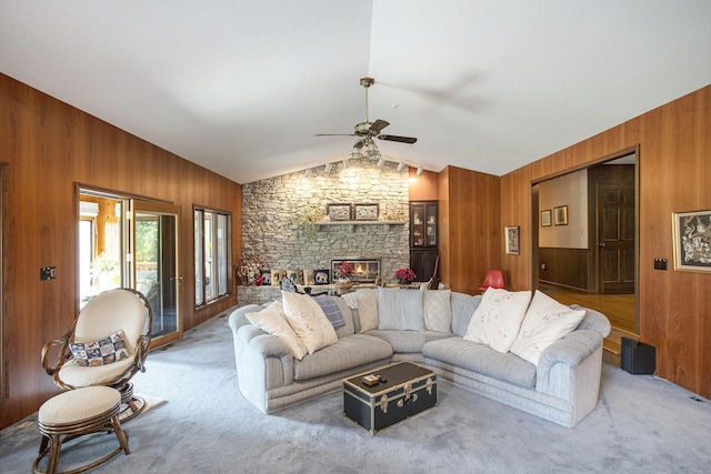 335 Fairway Dr, Coldwater, MI 49036 - living area featuring wooden walls, a ceiling fan, vaulted ceiling, and carpet