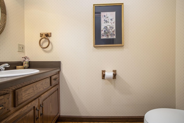 335 Fairway Dr, Coldwater, MI 49036 - half bathroom with vanity and wallpapered walls