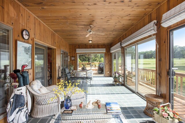 335 Fairway Dr, Coldwater, MI 49036 - sunroom with wood walls, plenty of natural light, and a ceiling fan