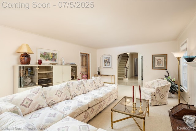 17 Colonial Rd, Grosse Pointe Shores, MI 48236 - carpeted living room with arched walkways, crown molding, and stairway