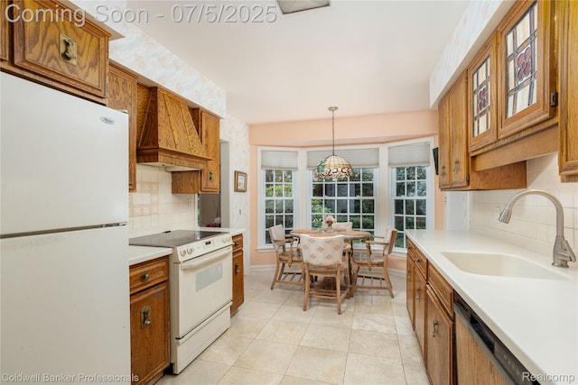 17 Colonial Rd, Grosse Pointe Shores, MI 48236 - kitchen featuring white appliances, brown cabinets, custom exhaust hood, decorative backsplash, and light countertops