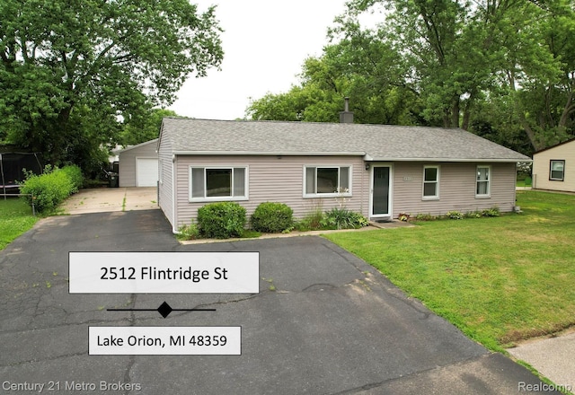 2512 Flintridge St, Lake Orion, MI 48359 - single story home featuring a front yard, a detached garage, an outdoor structure, and a shingled roof