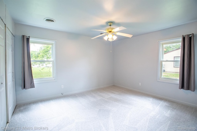 2512 Flintridge St, Lake Orion, MI 48359 - empty room with plenty of natural light, ceiling fan, and light colored carpet