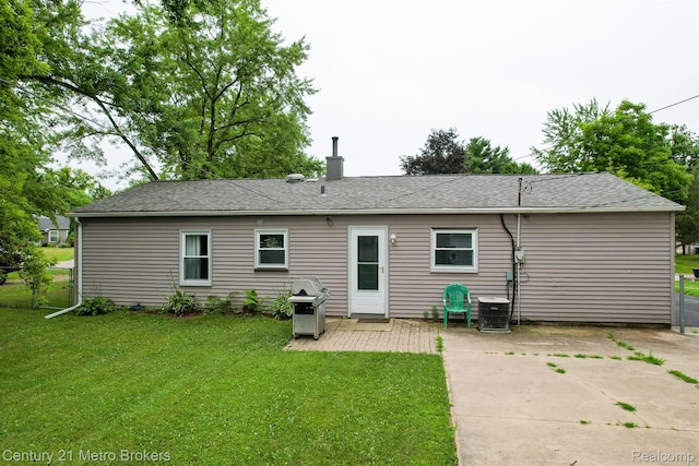 2512 Flintridge St, Lake Orion, MI 48359 - rear view of house featuring a patio area, a chimney, and roof with shingles