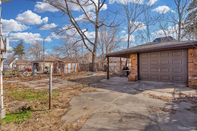 18040 Indiana St, Detroit, MI 48221 - view of property exterior featuring brick siding, an outbuilding, and concrete driveway