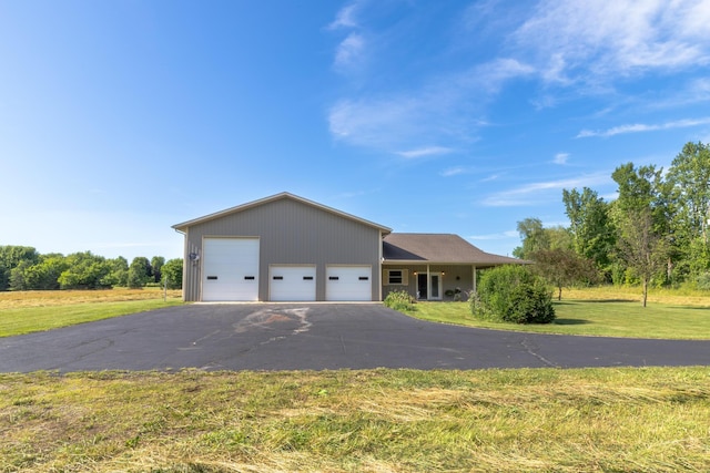 56234 Sink Rd, Dowagiac, MI 49047 - ranch-style home with a front yard and an attached garage