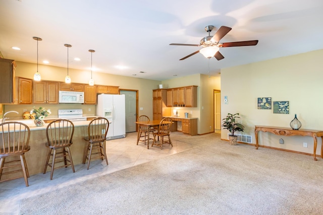 56234 Sink Rd, Dowagiac, MI 49047 - dining room with ceiling fan, light colored carpet, and recessed lighting