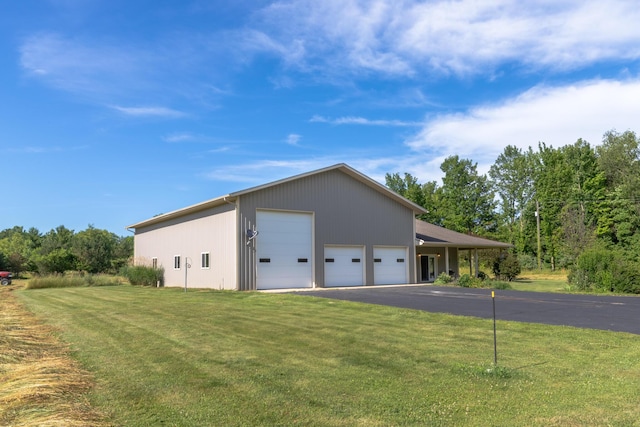 56234 Sink Rd, Dowagiac, MI 49047 - view of side of property with a lawn and a garage