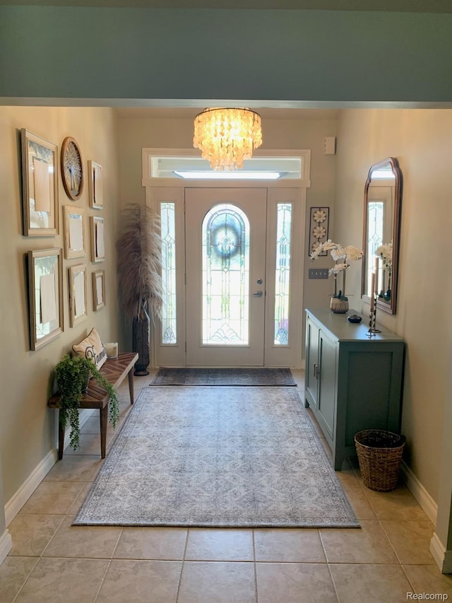23287 Angel Park Dr, Macomb, MI 48042 - entrance foyer featuring light tile patterned floors and a chandelier