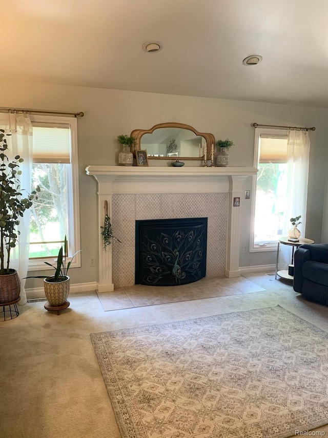 23287 Angel Park Dr, Macomb, MI 48042 - living room featuring a tile fireplace and carpet