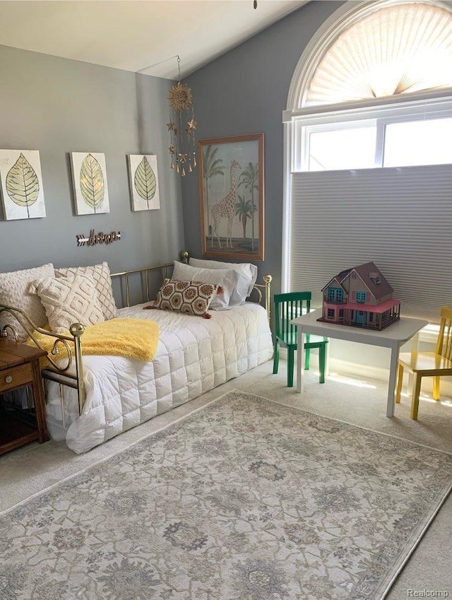 23287 Angel Park Dr, Macomb, MI 48042 - carpeted bedroom with vaulted ceiling and a chandelier