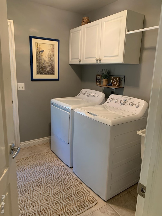 23287 Angel Park Dr, Macomb, MI 48042 - washroom with independent washer and dryer, cabinet space, and light tile patterned flooring