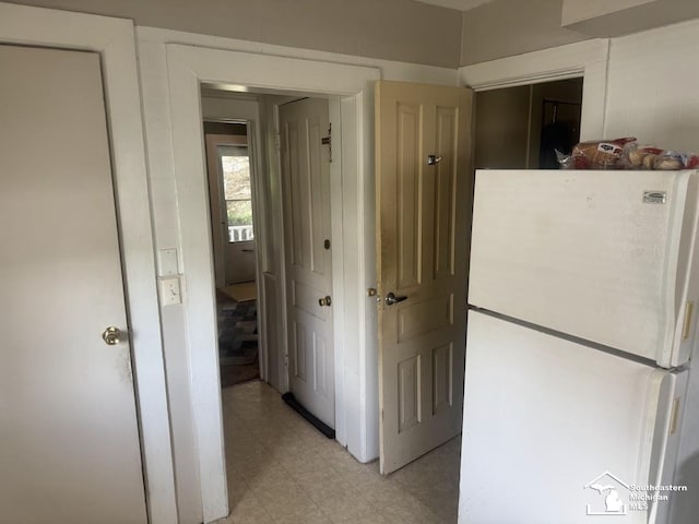 402 W Sixth St, Monroe, MI 48161 - hall with light tile patterned floors