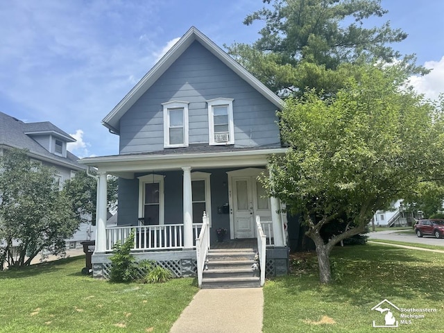 402 W Sixth St, Monroe, MI 48161 - view of front facade with covered porch and a front lawn