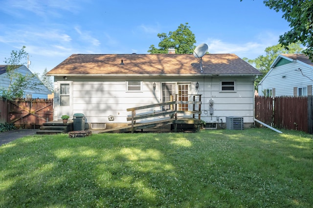 156 N Woodlawn Ave, Battle Creek, MI 49037 - rear view of house with a chimney and a shingled roof