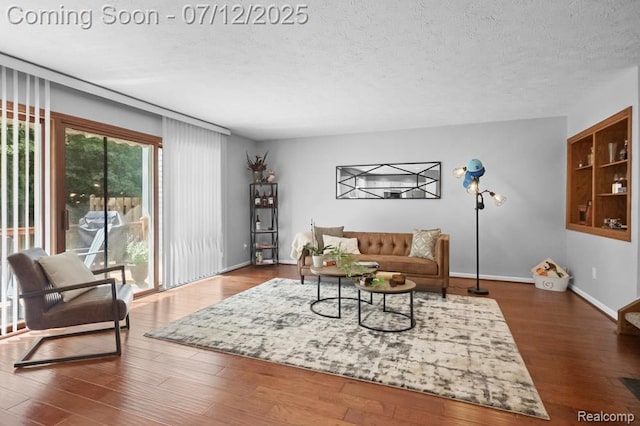 6559 Ridgeview Dr, Clarkston, MI 48346 - living area featuring a textured ceiling and wood finished floors