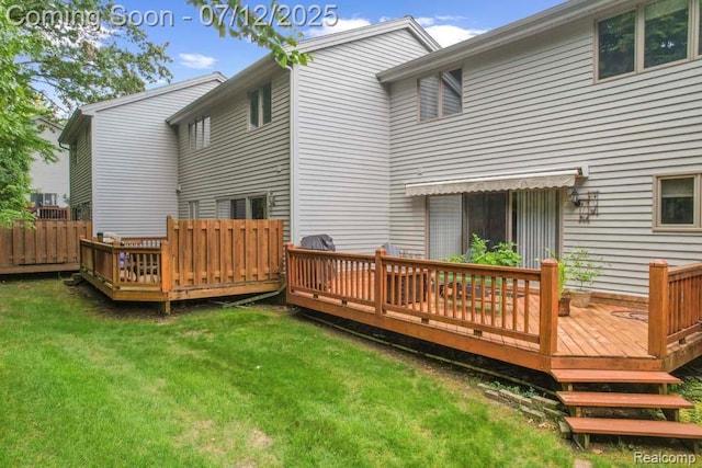 6559 Ridgeview Dr, Clarkston, MI 48346 - rear view of property with a yard and a wooden deck