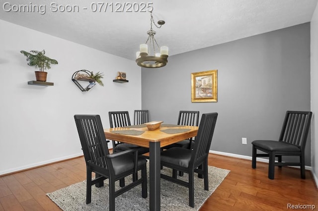 6559 Ridgeview Dr, Clarkston, MI 48346 - dining room with wood finished floors and a chandelier