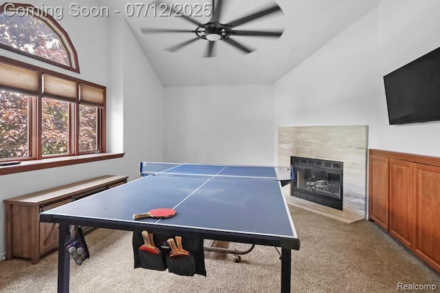 6559 Ridgeview Dr, Clarkston, MI 48346 - game room with ceiling fan, light colored carpet, a fireplace, and high vaulted ceiling