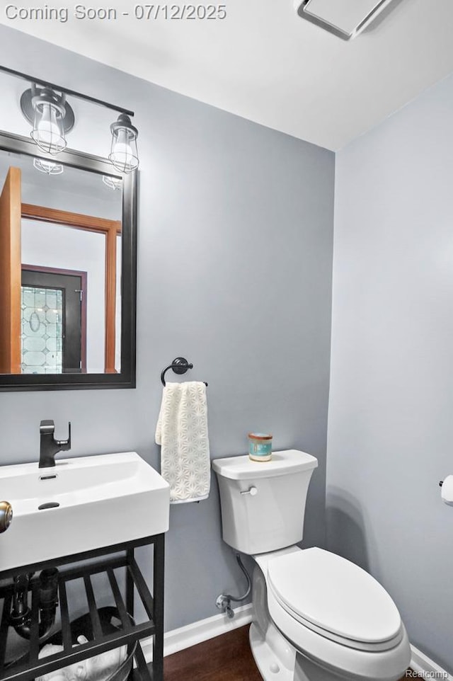 6559 Ridgeview Dr, Clarkston, MI 48346 - half bath with wood finished floors and vanity