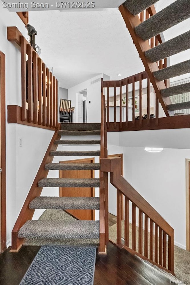 6559 Ridgeview Dr, Clarkston, MI 48346 - stairs featuring wood finished floors and baseboards