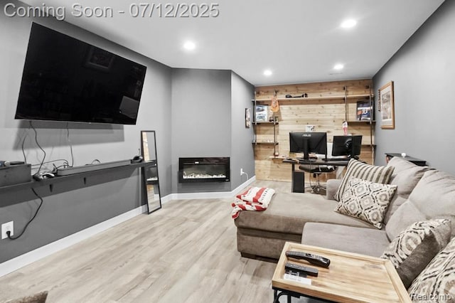 6559 Ridgeview Dr, Clarkston, MI 48346 - living area with wooden walls, wood finished floors, recessed lighting, and a desk