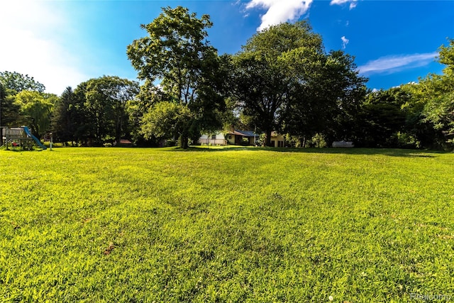 2380 Wilder Rd, Metamora, MI 48455 - view of green lawn with a playground