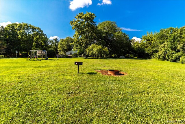 2380 Wilder Rd, Metamora, MI 48455 - view of grassy yard with a playground