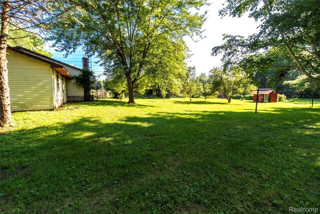 2380 Wilder Rd, Metamora, MI 48455 - view of green lawn featuring a storage unit