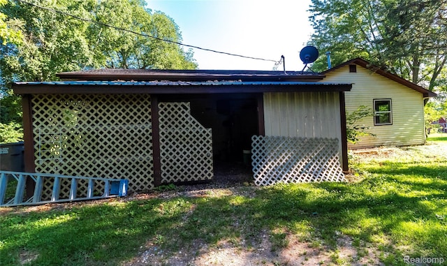 2380 Wilder Rd, Metamora, MI 48455 - view of side of home featuring a yard and a metal roof
