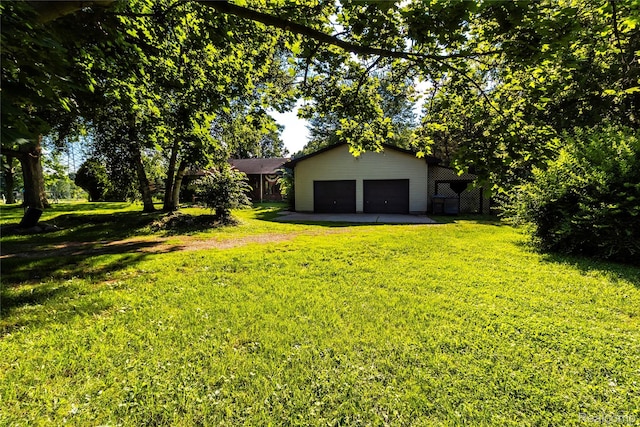 2380 Wilder Rd, Metamora, MI 48455 - view of grassy yard with driveway and an attached garage